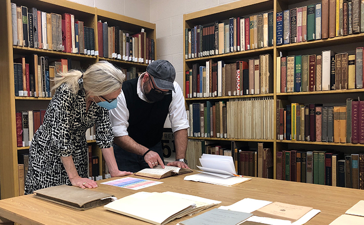 University Archivist, Kieth A. Peppers, shares historical documents from Dayton C. Miller's years at BW with Library of Congress researcher Dr. Carol Lynne Ward-Bamford.