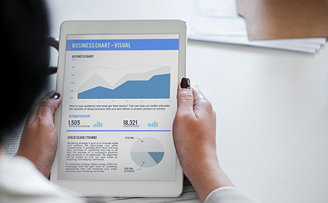 Student looks at business chart on a tablet