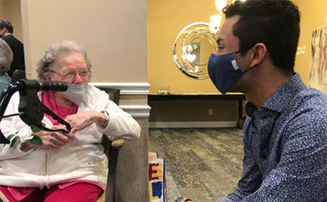 BW Rotaract Club member Grant Cordle ‘23, right, visits with his "bingo buddy" Rhonda Hovanek at Generations Senior Living Berea. (Photo by Linda G. Kramer)