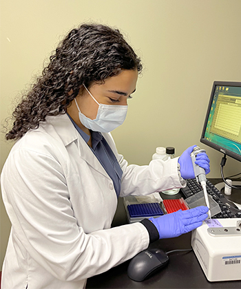 Madina Mahmoud researching in lab