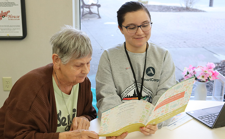 BW AmeriCorps volunteer Brooke Guddy ’23), a BW public health major, connects with a client at the Old Brooklyn Senior Center.