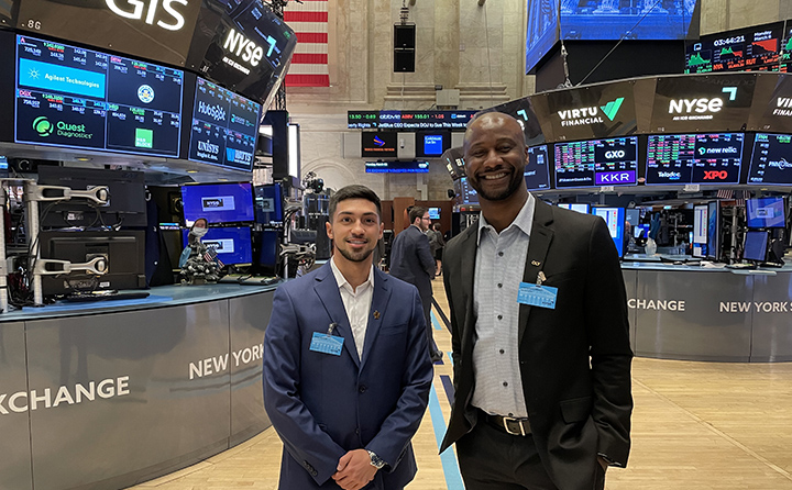 Ryan Rivera ’23 (left) and Dr. Christian Nsiah (right) on the floor of the New York Stock Exchange.