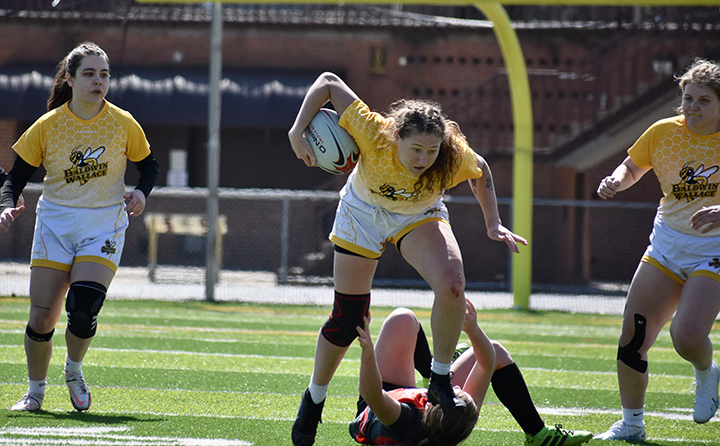 BW women's rugby center Molly Cancian '23 with the ball