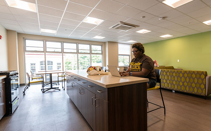 Photo of Student in Front Street Residence Hall Lounge