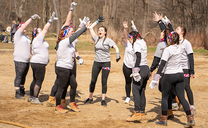 BW students April Reign tug of war team with arms raised