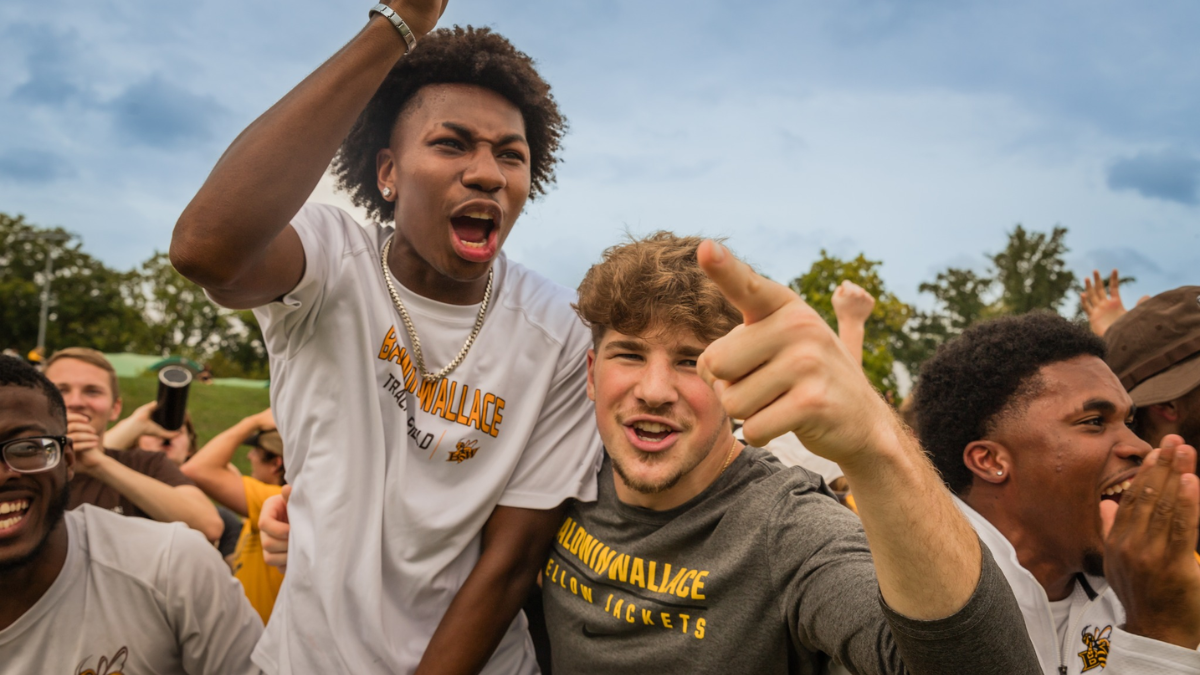 Students cheer on the Yellow Jackets