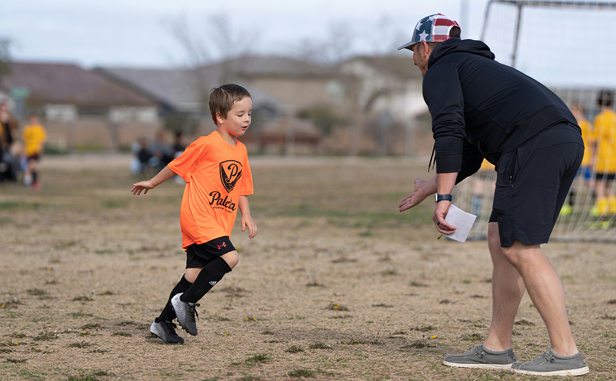 Coach encourages young player