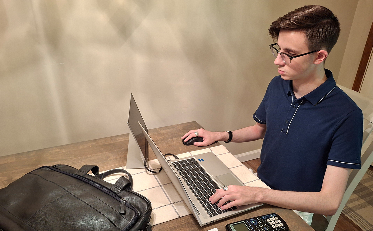 Devin Bennett at a laptop for his internship