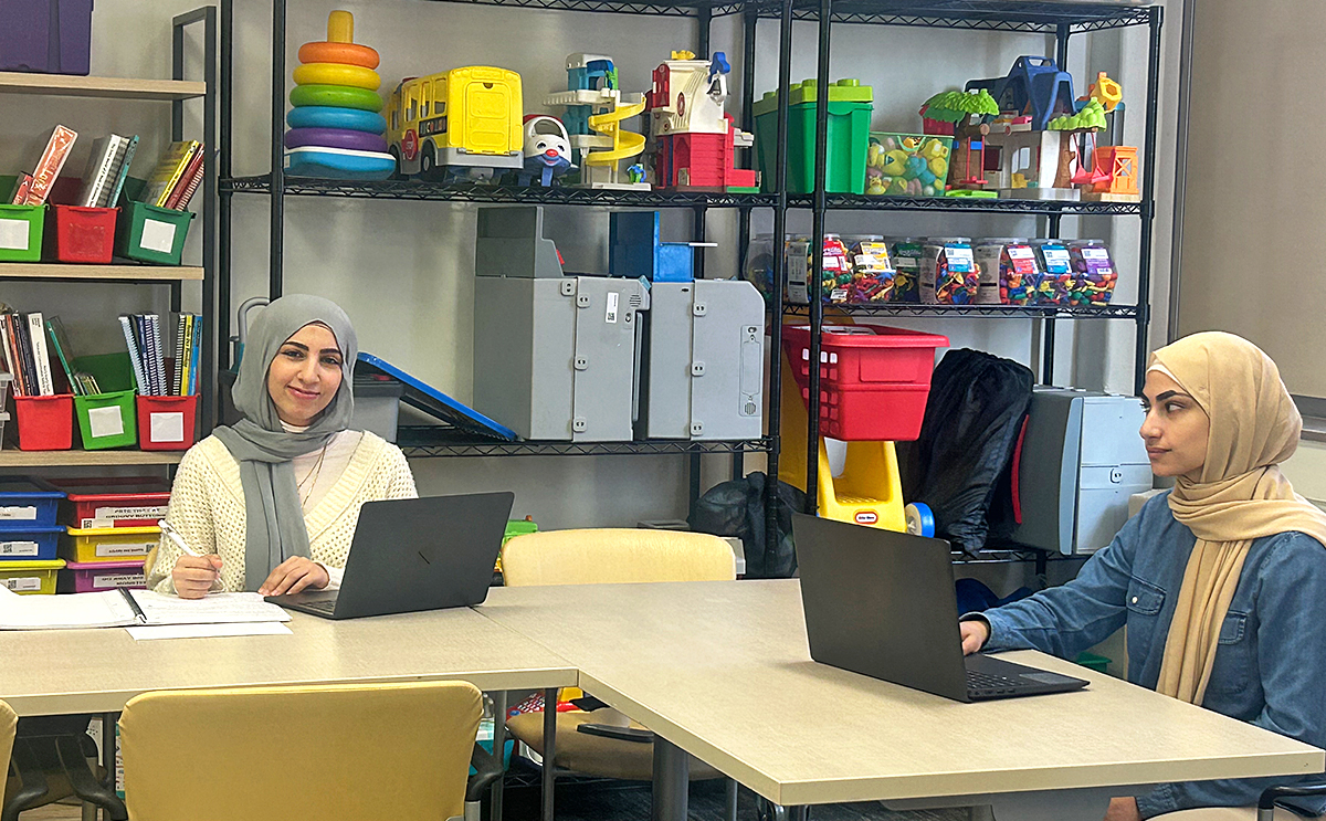 Two students in student resource room
