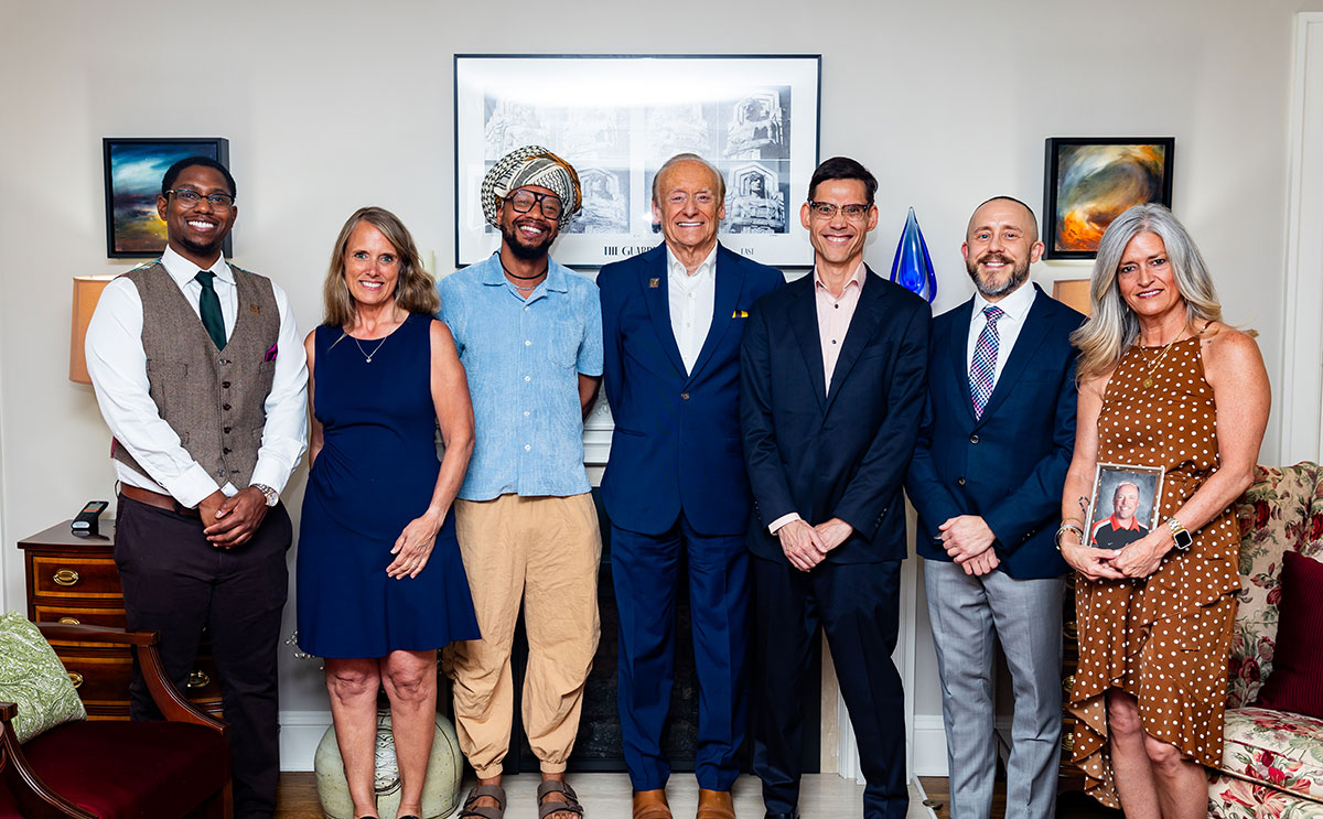 2026 BW Alumni Award winners with President Fisher (center)