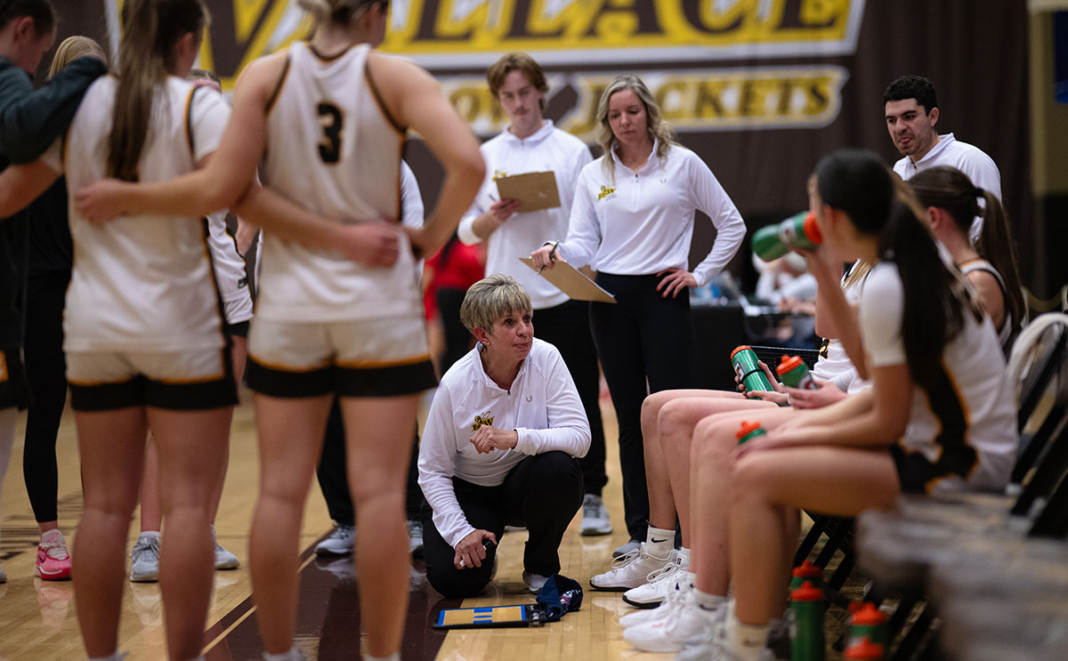 Head coach Cheri Harrer with team