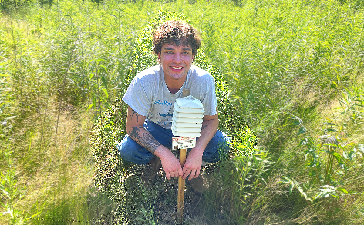 Noah Baer doing field work