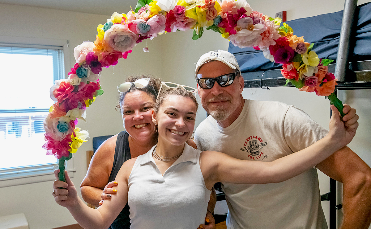 students and family members take a fun selfie