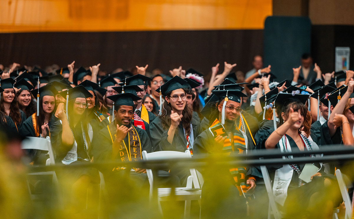 Graduates give the "awww Jackets" cheer