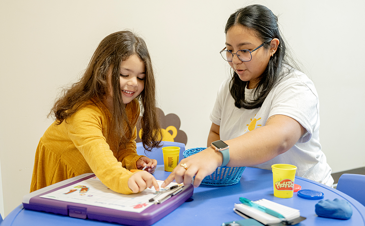 BW student clinician works with a child at Speech Clinic