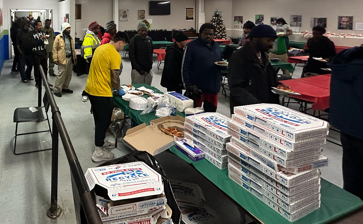 Serving pizza