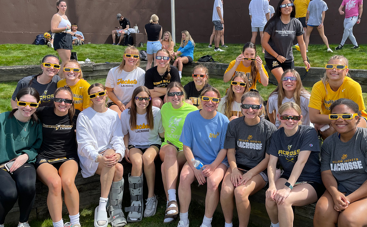 Women's Lacrosse team at eclipse event