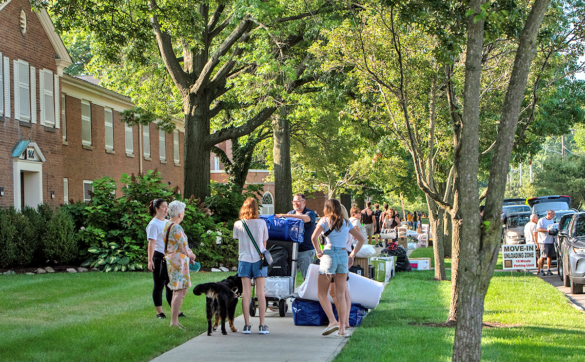 Students unpacking vehicles during move-in